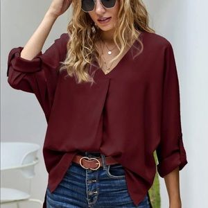 Maroon v neck high low button sleeve blouse